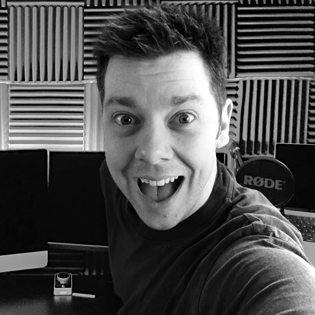 Black and white photo of James Marshall looking excitedly at the camera